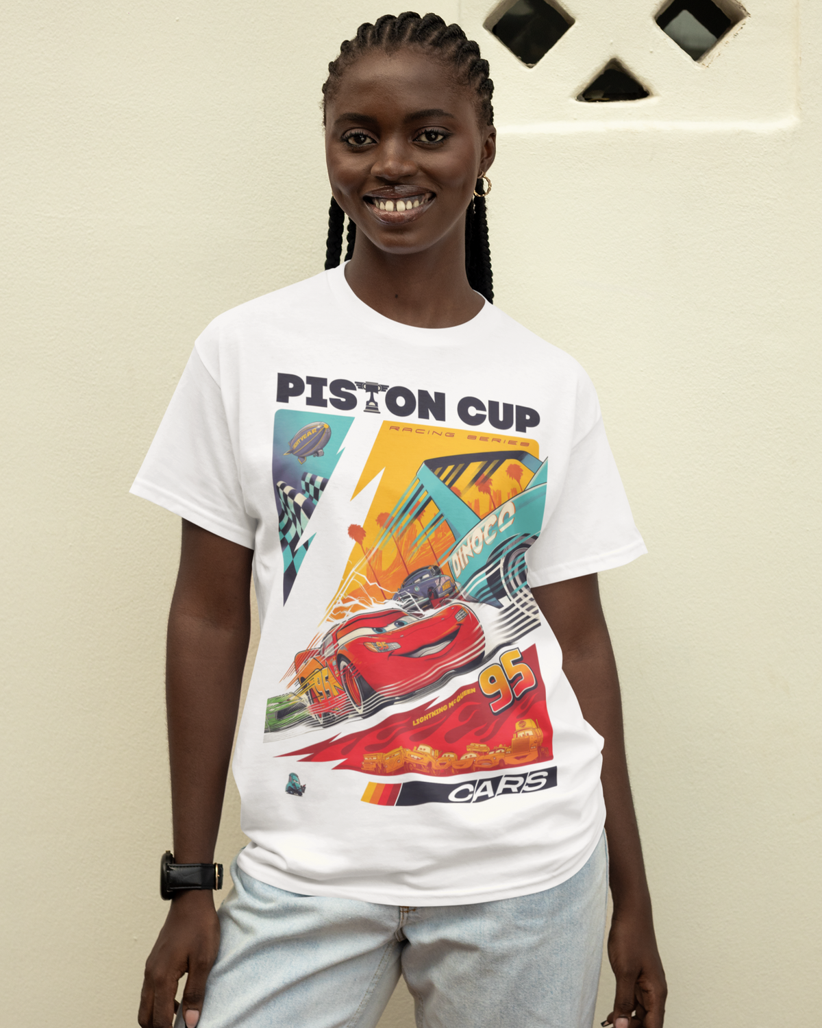 Model wearing the Cars Piston Cup graphic tee – 808's