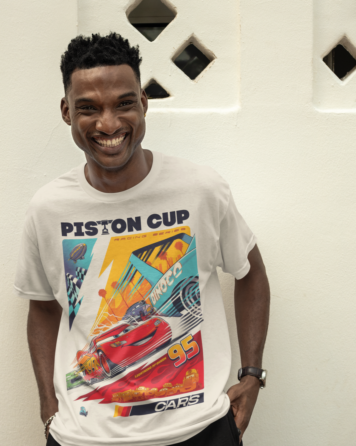 Model wearing the Cars Piston Cup graphic tee – 808's